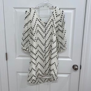 Cream long sleeve dress with black box chevron pattern. Size large.